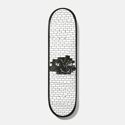 Baker Kader Frenz 8.25 skateboard deck: White brick wall drawn in black line with a broken hole through which a black panther-like animal's glaring eyes can be seen, with a black edge around the deck.