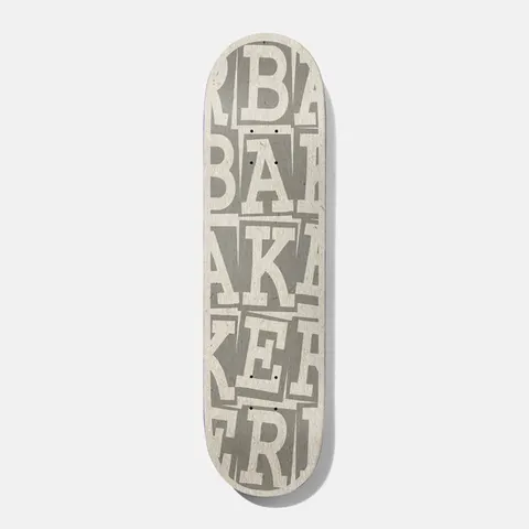 Baker Kader Ribbon Stack 8.0 B2 skateboard deck: Baker name in large cream serif letters stacked and overlapping in rows across the whole deck, over a grey, paper-like texture.