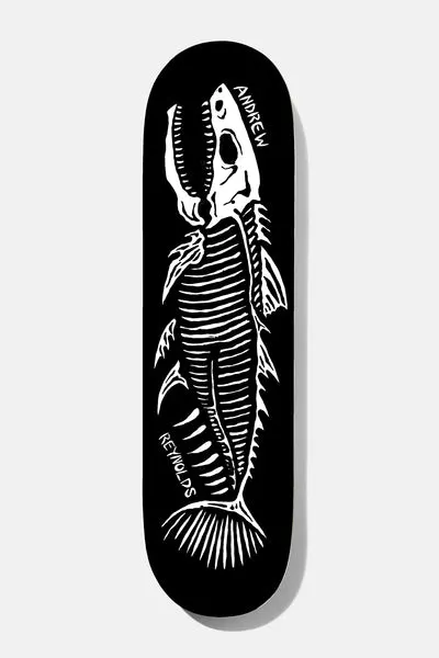 Baker Reynolds Fish Sticks 8.25 skateboard deck: White hand-drawn skeleton of a fish with open jaws, ribs and fins on a black deck, with Andrew Reynolds written in white beside it.