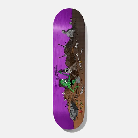 Baker Rowan Wizardry 8.5 skateboard deck: Cartoon graveyard scene in which a green hooded creature digs a grave among tombstones, bones and a skull, with a speech line of small text. Purple wood stain on the top and brown earth below.