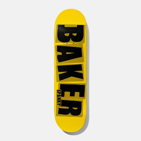 Baker Spanky Brand Name Yellow/Black B² 8.25 skateboard deck: The Baker logo in large black block capitals on a yellow deck, each letter on its own slightly offset olive tile, with SPANKY in small capitals beside the R.