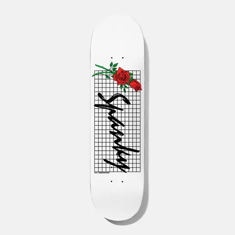 Baker Spanky Roses 8.25 skateboard deck: White deck with a black grid panel, two red roses with green stems at the top and a large black handwritten Spanky signature running down the board.