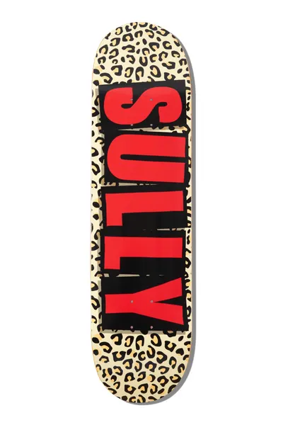 Baker Sully Logo Leopard 8.38 skateboard deck: Cream deck with a leopard-spot print and a black block carrying the word SULLY in tall red capitals running the length of the board.