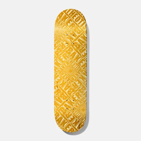 Baker Theotis Labyrinth Yellow 8.475 skateboard deck: All-over repeating pattern of the Baker and Theotis names in bold block capitals, stacked and rotated at diagonals to form a dense maze-like labyrinth, in tone-on-tone yellow and cream.