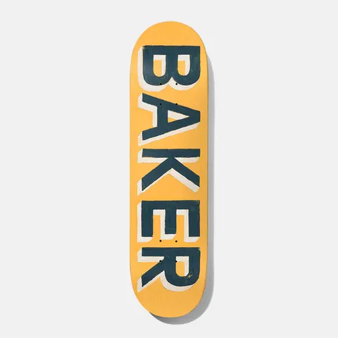 Baker Tyson Painted 8.5 skateboard deck: The word BAKER in large hand-painted dark teal capitals with a cream drop shadow, running vertically down a mustard yellow deck.