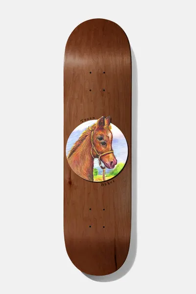 Baker Tyson Seasons B2 8.5 skateboard deck: A painted portrait of a brown foal in a rope halter inside a circle with sky and grass behind, on a brown wood-grain deck, with 'Tyson' and 'Baker' handwritten around the edge.