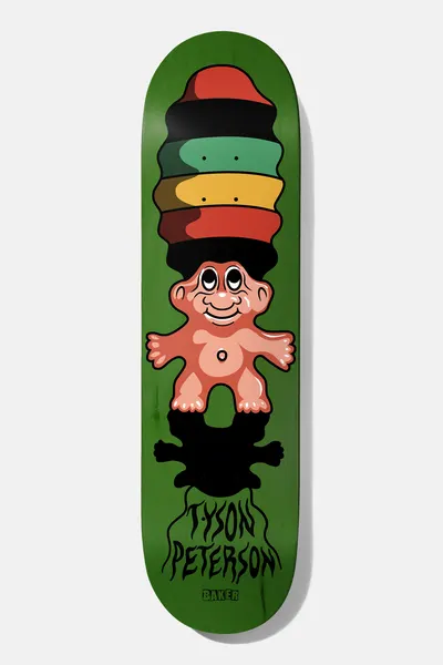 Baker Tyson Trollsafari 8.25 skateboard deck: Smiling troll doll with a tall striped afro in red, black, green and yellow, casting a dripping black shadow with the rider name in drip lettering, on a green deck.