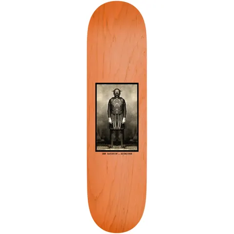 Birdhouse Ben Raybourne Beautiful Mutants 8.38 skateboard deck: A small framed sepia photograph of a standing figure in a costume with horned mask and fringed skirt, centred on an orange-stained wood deck, with a typewritten caption beneath.