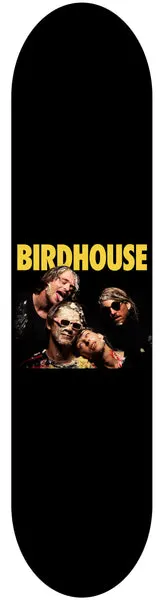 Birdhouse Damn 8.25 skateboard deck: Plain black deck with the yellow Birdhouse logo across the middle, above a colour photograph of four people in dark clothing and sunglasses posed close together.