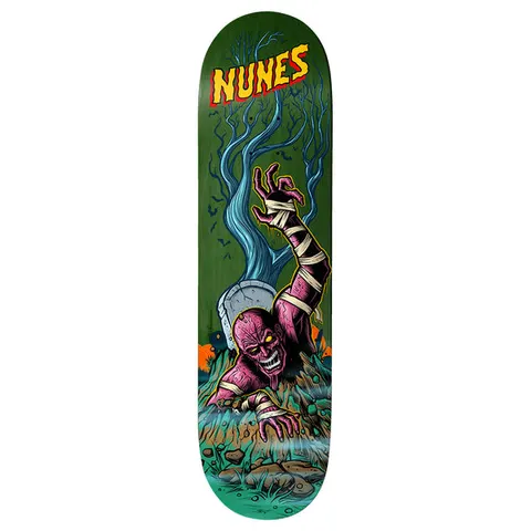 Birdhouse Felipe Nunes Graveyard 8.25 skateboard deck: A purple bandaged mummy-like zombie claws its way out of a grave, one arm raised, beside a headstone and a bare blue tree on a green deck. Yellow and red 'Nunes' lettering sits at the nose.
