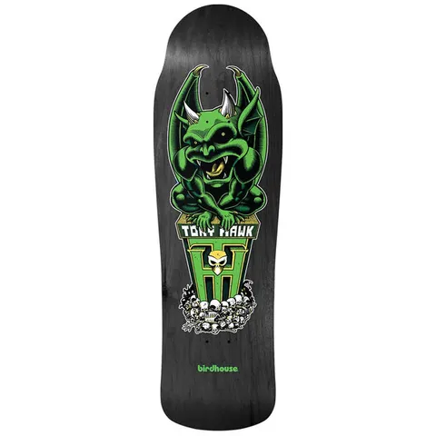 Birdhouse Gargoyle 9.75 skateboard deck: Green horned gargoyle crouching on a pedestal carrying the rider name and a large H emblem with a small skull, above a pile of skulls, on a black stained old-school shaped deck.