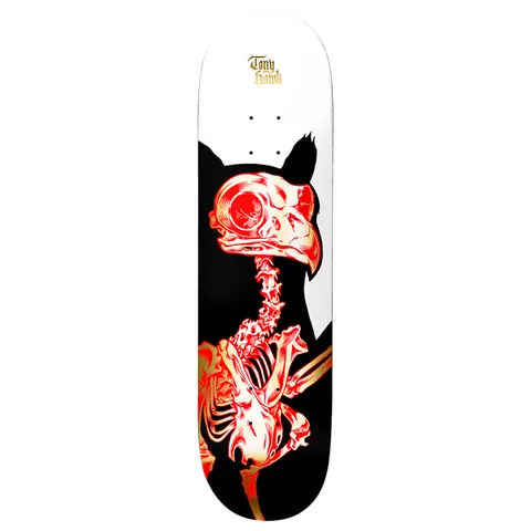 Birdhouse Hawk Golden Remains 8.25 skateboard deck: X-ray style red and gold skeleton of a hawk with a large beak and eye, set against a black silhouette of the bird on a white upper deck. Tony Hawk name in small gold gothic lettering at the top.