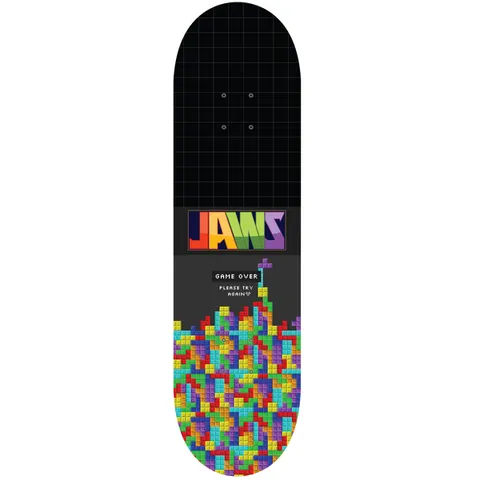 Birdhouse Jaws Game Over 8.25 skateboard deck: Black deck with a faint grid, a multicoloured 'JAWS' logo and a heap of stacked falling-block puzzle pieces rising from the tail, with a 'Game Over' message in pixel text.