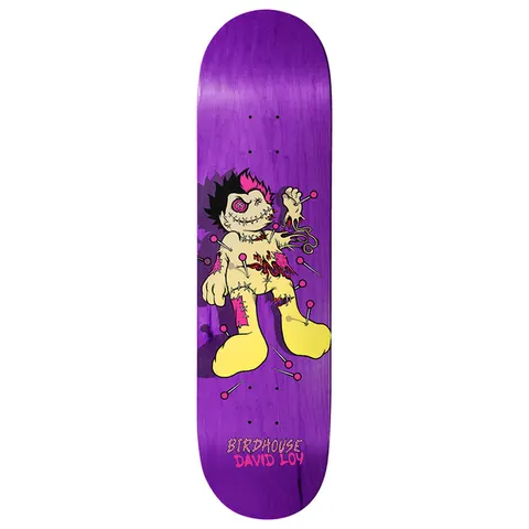 Birdhouse Loy Pinman 8.475 skateboard deck: A stitched cartoon voodoo doll with spiky black and pink hair, a button eye, torn patches and pins stuck in its body, standing on a purple stained deck. Brand and rider name appear at the bottom.