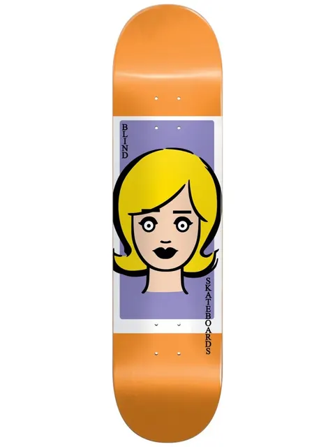 Blind Girl Doll Orange 8.375 skateboard deck: A simple cartoon doll's face with blonde hair, wide eyes and black lips sits in a lilac panel with white border across an orange deck. Blind Skateboards is written vertically either side.