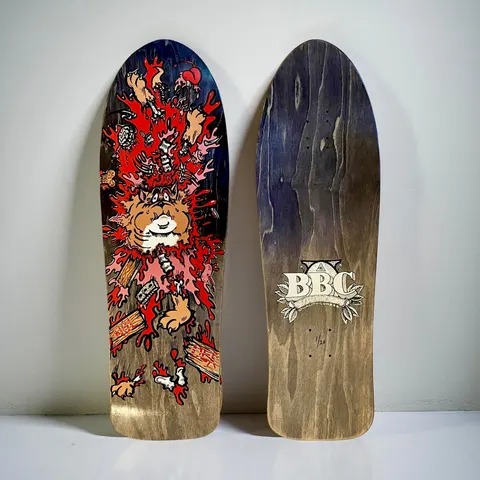 Brand-X Monty Nolder Exploded Bulldog (#3) skateboard deck: Cartoon bulldog bursting apart in a splatter of red blood, with limbs, bones, a heart and debris flying out, on a dark stained old-school shaped deck. The underside shows a BBC crest logo with a numbered edition mark.
