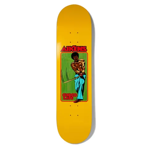 Chocolate Aikens Kung - Fu Carlisle Yellow skateboard deck: Retro kung-fu poster style illustration of a shirtless man with an afro swinging a sword, wearing flared teal trousers, framed in a red-bordered green panel on a yellow deck.