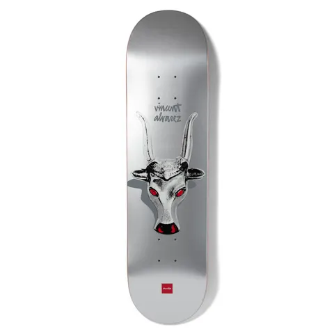 Chocolate Alvarez Longhorn skateboard deck: Metallic silver deck with a monochrome horned bull's head with glowing red eyes and nose, casting a shadow, with the rider's name in grey handwriting above and a small red Chocolate logo at the bottom.
