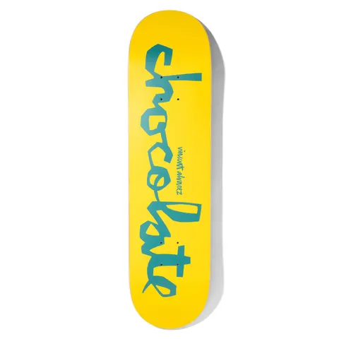 Chocolate Alvarez Original Chunk Pop Secret skateboard deck: Bright yellow deck with the Chocolate 'Chunk' logo in large teal hand-cut letters running the length of the board, and a small teal 'Vincent Alvarez' signature.
