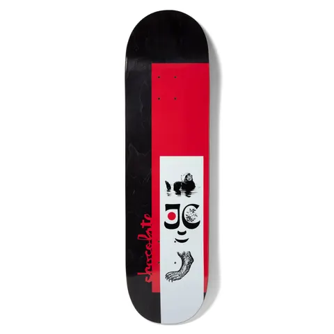 Chocolate Capps JC Explorer skateboard deck: Black-stained deck with a red panel and a white inset block containing a sea otter, a stylised smiling face with a red dot eye, and a clawed foot, in black and white. Chocolate script runs up the side in red.