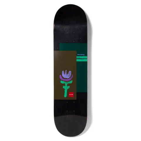 Chocolate Eldridge Icon skateboard deck: Black stained deck with overlapping olive-brown and dark green rectangles. A crude crayon-style purple and green flower sits on the brown panel, with a small red Chocolate logo and handwritten blue text on the green one.