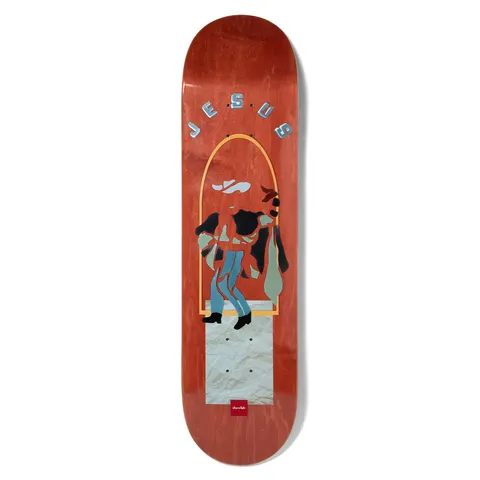 Chocolate Fernandez Paper Dancer skateboard deck: A cut-paper style figure in a cowboy hat, jeans and boots sits on a crumpled paper block inside a gold arch. Metallic blue lettering arcs across the top, on a red wood stain.