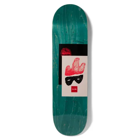 Chocolate Herrera Icon skateboard deck: Crayon-style drawing of a red flame-like hat above a black eye mask on a cream panel, overlapping a black rectangle with a red circle. Small red Chocolate logo, on a teal wood-stain deck.