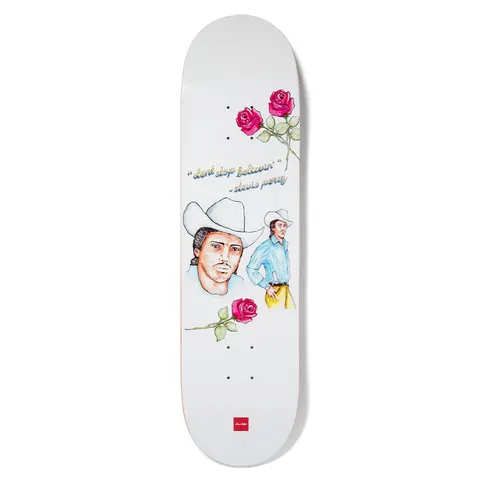 Chocolate Perez Believin skateboard deck: White deck with watercolour-style illustrations of a man in a white cowboy hat, a second cowboy in a blue shirt, and three red roses. A handwritten quote and attribution sit above, with a small red Chocolate label.