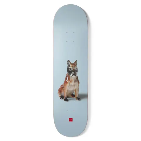 Chocolate Perez Porcelain skateboard deck: Photograph of a glazed porcelain boxer dog figurine sitting on a plain pale blue background, with a small red Chocolate logo at the tail.