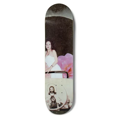 Chocolate Perez Quince skateboard deck: Collage-style photograph of a young woman in a white dress standing in an open-top car beside a large pink flower, with a halo-framed image of Jesus on the car door and a dark curved sky above.