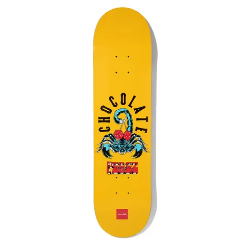 Chocolate Perez Scorpion Dice skateboard deck: A blue scorpion holding a pair of red dice in its tail sits beneath arched Chocolate lettering, with Perez in red block letters below, on a plain yellow deck with a small red Chocolate logo at the tail.