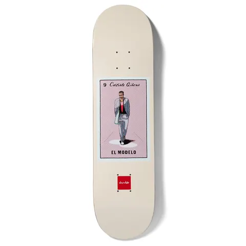 Chocolate Aikens Loteria skateboard deck: Cream deck with a lotería card in the centre: a man in a grey suit and green scarf walking in a spotlight on a pink background, captioned El Modelo and numbered 9. Chocolate logo below.
