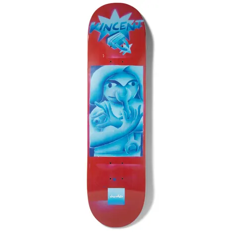 Chocolate Alvarez JPs World skateboard deck: Airbrushed blue-toned painting of a cartoon figure wearing a hat, with hands making a gesture and a spanner, in a panel on red. Rider name in spiky lettering on a burst at the top and Chocolate logo at the tail.