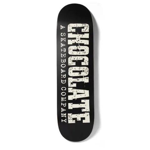 Chocolate Alvarez Western skateboard deck: Black deck with cream distressed slab-serif lettering spelling CHOCOLATE vertically, with A Skateboard Company in spaced-out typewriter capitals running alongside it.