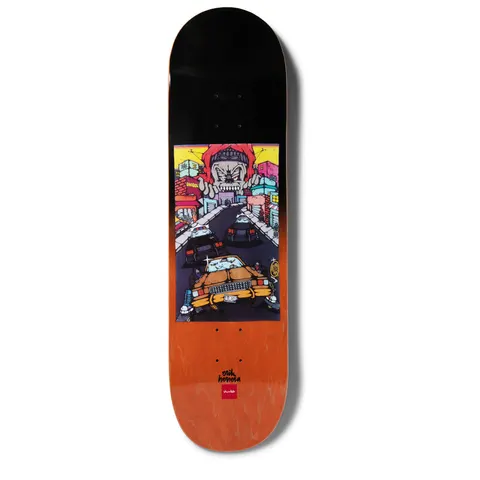 Chocolate Herrera Fiendin skateboard deck: Graffiti-style street scene of a yellow low-rider car chased by police cars, with a giant hooded skull face looming over colourful buildings. Black to orange faded deck with the rider name and Chocolate logo.
