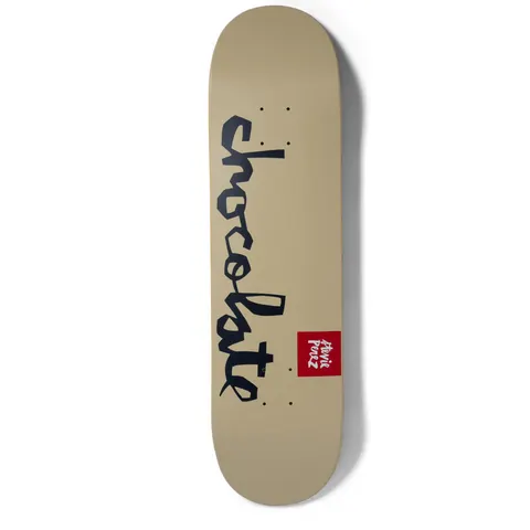 Chocolate Perez Team Chunk skateboard deck: Plain tan deck with the Chocolate handwritten script logo in navy running down its length and a small red Chocolate label with the rider's name near the tail.