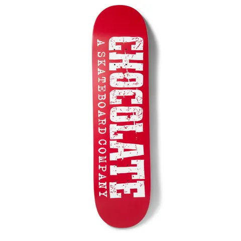 Chocolate Tershy Western skateboard deck: Large distressed Western-style slab lettering spelling Chocolate runs the length of a red deck, with 'A Skateboard Company' in smaller type alongside, all in white with red speckles.