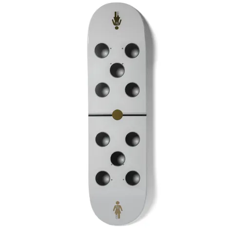 Girl Malto Goodlife skateboard deck: Pale grey deck styled as a domino, with five dark recessed-looking circles on each half divided by a thin black line and gold centre dot. The Girl figure logo sits at the tail and a small gold logo at the nose.