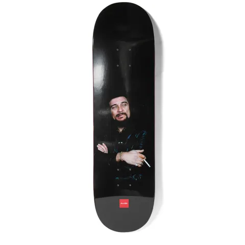 Chocolate Waylon Perez skateboard deck: Dark photographic portrait of a bearded man in a black leather jacket with arms folded, holding a cigarette, against a black background. Small red Chocolate logo at the tail.