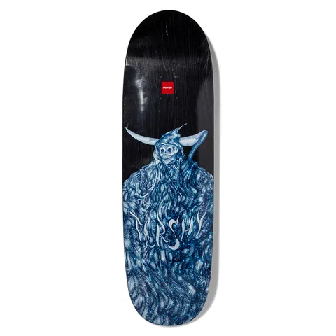 Chocolate Tershy Infinite Couch skateboard deck: Blue and silver painted horned skeleton figure in a shaggy robe of swirling hair, with the rider name in wispy lettering across it, on a black deck with a small red Chocolate logo.