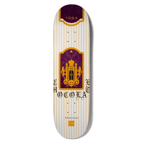 Chocolate Trahan Burn One skateboard deck: White deck with fine orange pinstripes and a purple and orange arched panel showing a domed palace flanked by two lions, with 1994 in a banner at the top and old English Chocolate lettering split around the panel.