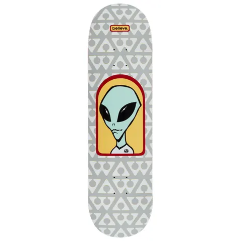 Alien Workshop Believe Pattern Grey skateboard deck: Alien head with large black eyes inside a red and yellow arched frame, over a grey and white repeating pattern of triangle and circle symbols. A small red believe. tag sits near the nose.