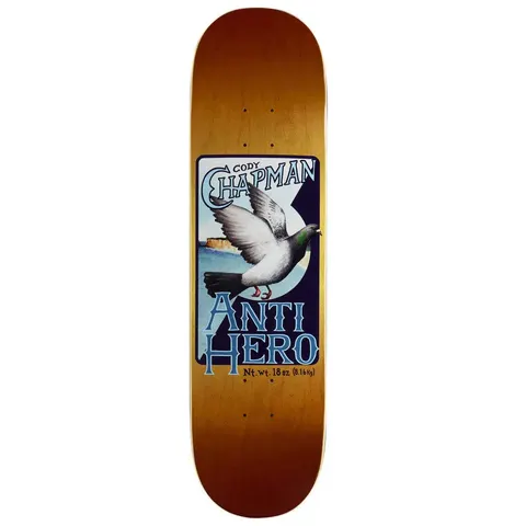 Anti Hero Chapman Homers skateboard deck: Framed painting-style illustration of a grey homing pigeon in flight over a sea and cliff, on an amber-stained deck. Lettering reads like a vintage label, with a net weight line at the bottom.