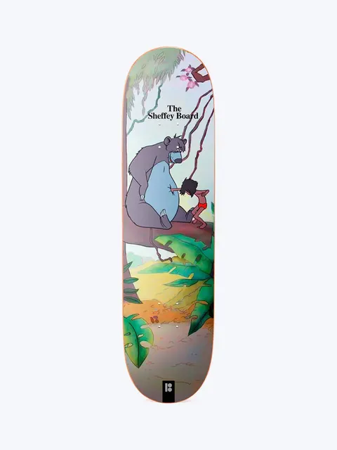 Plan B Sheffey Junglebook skateboard deck: Cartoon jungle scene with a large grey bear sitting on a branch beside a small boy in red shorts, among green leaves and vines. The Sheffey Board is printed at the top and a Plan B logo sits at the tail.