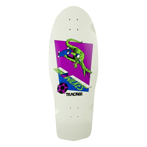 Tracker Dan Wilkes skateboard deck: Old-school shaped white deck with a purple and blue panel showing a green lizard-like creature riding a skateboard past a kerb or ledge. Rider name runs in green letters along the ledge, with a star logo and the Tracker name below.