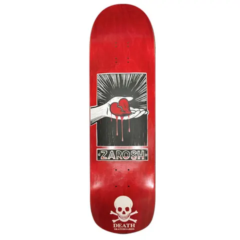 Death Skateboards Death Zarosh Heart 9 Pool skateboard deck: Black and white panel of a hand holding a broken, dripping red heart against radiating lines, above a name plate, on red stain. Skull and crossbones logo at the tail.