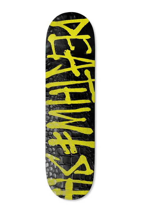Deathwish Croc Spray 8.25 skateboard deck: The Deathwish name sprayed in loose yellow paint letters runs along a black deck embossed with a glossy crocodile-skin texture.