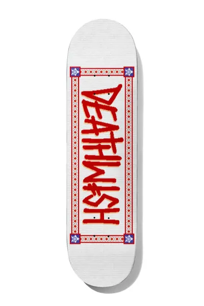 Deathwish Deathspray Knitted 8.5 skateboard deck: The Deathwish logo in red spray-style letters, running down the deck inside a red decorative border with diamond patterns and blue star corner motifs. Printed to look like knitted fabric on white.