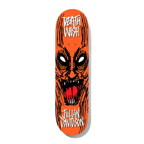 Deathwish Julian Macabre 8.125 skateboard deck: A hand-drawn snarling orange demon face with white eyes, red open mouth and sharp teeth, with scratchy black lines across an orange deck. The Deathwish logo is at the top and the rider name at the bottom in white scrawled lettering.