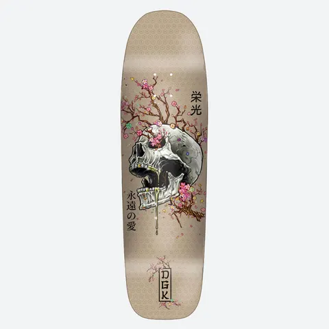 DGK Ancestry 8.75 skateboard deck: A cracked white skull with gold teeth is wreathed in pink cherry blossom branches on a tan shaped deck with a faint floral pattern, with Japanese characters beside it and a boxed DGK logo at the tail.